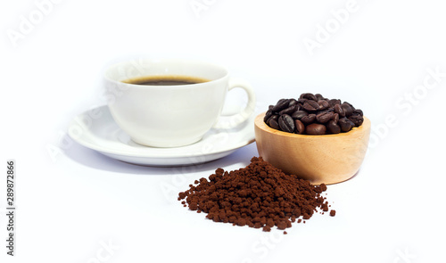 Closeup of coffee bean in wooden bowl and coffee powder with black coffee in white cup. isolated on white