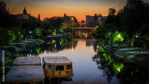 Tablou pe pânză Romania , Timisoara night city photography boats on canal Bega river