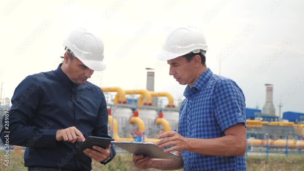 teamwork gas production station concept. slow motion video. two