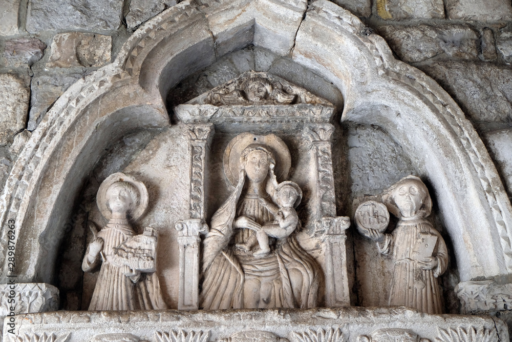 Virgin Mary with baby Jesus and Saints, detail of grand gate of old town of Kotor, Montenegro, UNESCO World Heritage Site