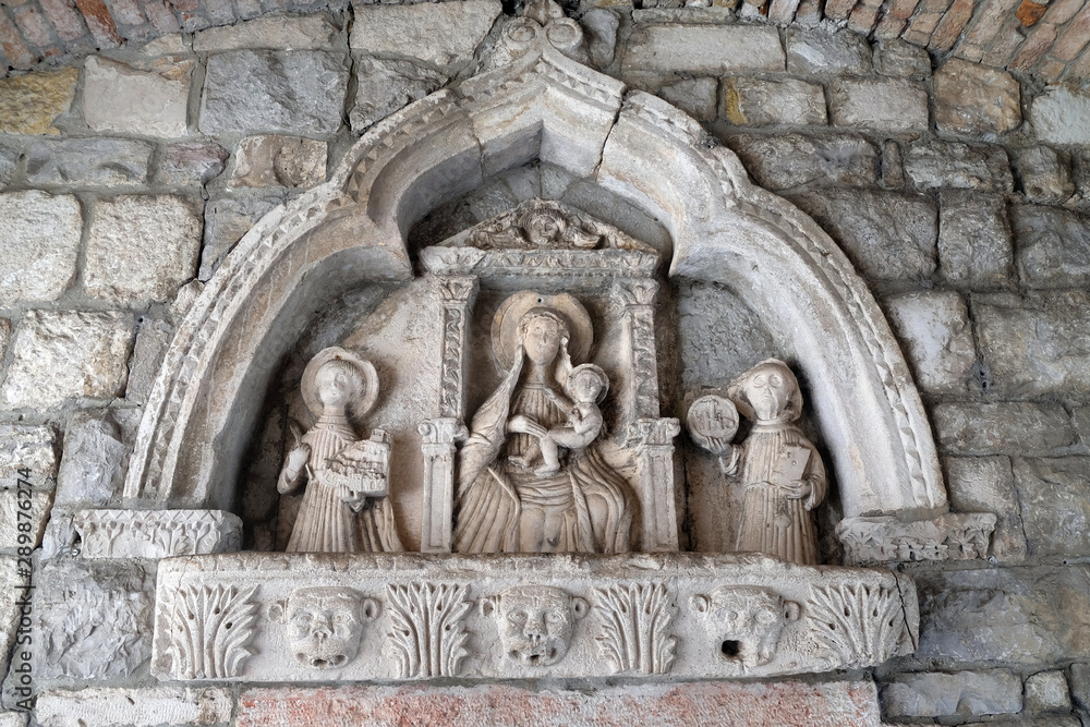 Virgin Mary with baby Jesus and Saints, detail of grand gate of old town of Kotor, Montenegro, UNESCO World Heritage Site