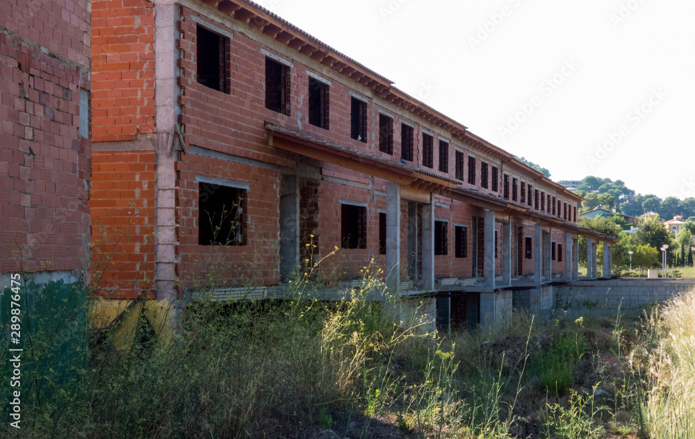 Abandoned unfinished buildin, Destroyed  brick structures of unfinished building