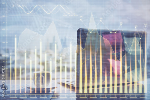 Financial market graph hologram and personal computer on background. Double exposure. Concept of forex.