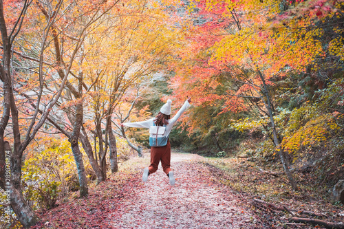 Young woman traveler enjoying beautiful autumn in Japan, Travel lifestyle concept