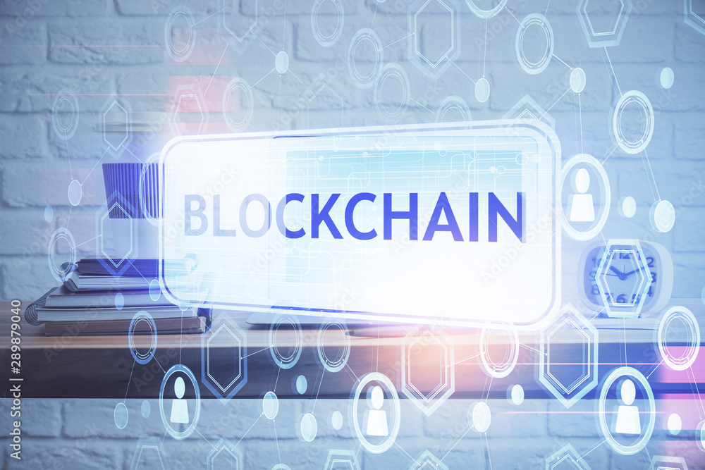 Multi exposure of blockchain theme hologram and table with computer background. Concept of bitcoin crypto currency.