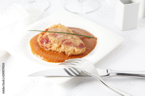 Lomo rebozado con jamón y queso. Breaded loin with ham and cheese.