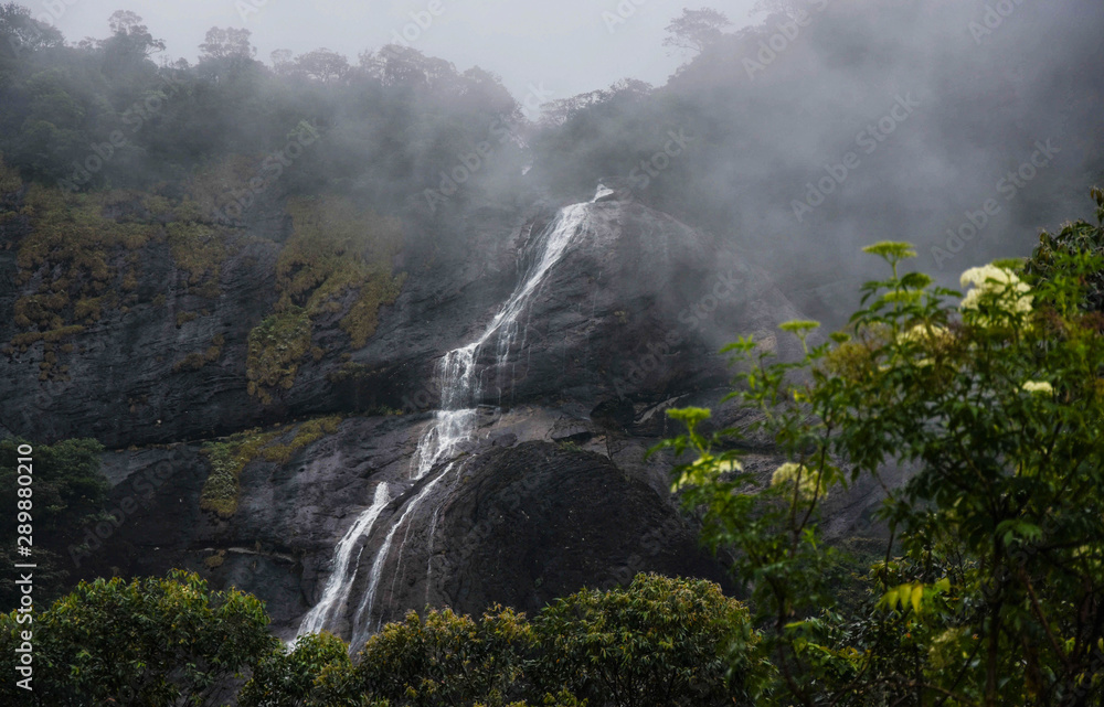misty waterfall in Sri Lanka, seasonal falls in scared peak, adam's peak