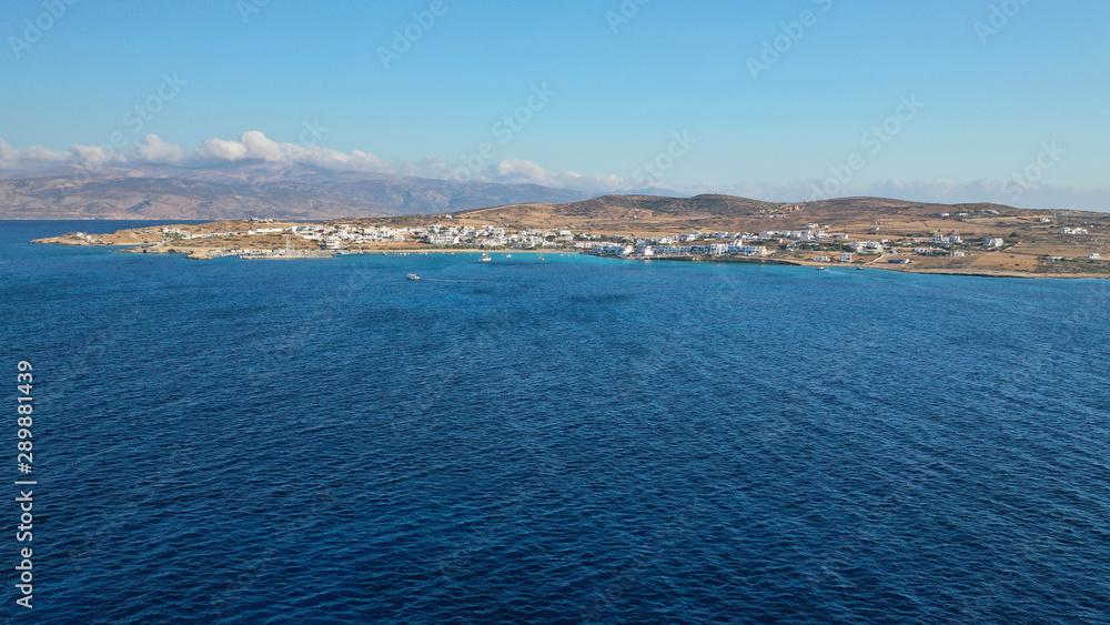 Aerial drone photo of famous sandy turquoise beach of Ammos and main port of Koufonisi island, Small Cyclades, Greece