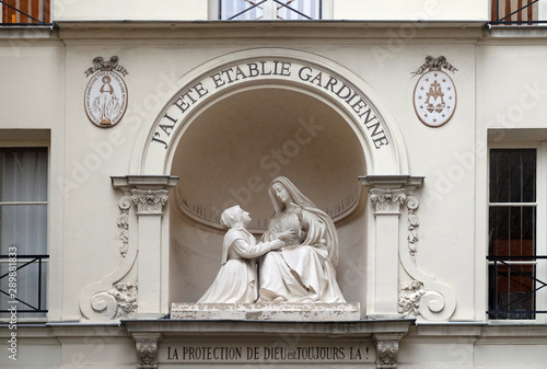 Statue of St Catherine and the Virgin Mary outside the Chapelle Notre Dame de la Medaille Miraculeuse in Paris, France