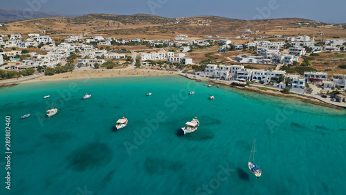 Aerial drone photo of famous sandy turquoise beach of Ammos and main port of Koufonisi island, Small Cyclades, Greece