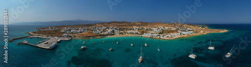 Aerial drone photo of famous sandy turquoise beach of Ammos and main port of Koufonisi island, Small Cyclades, Greece © aerial-drone