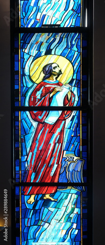 Saint John the Evangelist, stained glass window in the Church of Saint Benedict in Micevec, Zagreb, Croatia photo