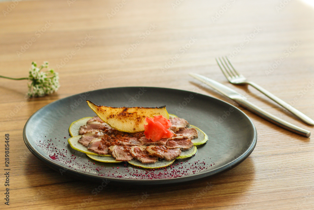 carpaccio meat duck and pear (savory snack, gourmet cuisine) menu concept. food background. copy space. Top view carpaccio meat duck and pear (savory snack, gourmet cuisine) menu concept. food background. copy space. Top view
