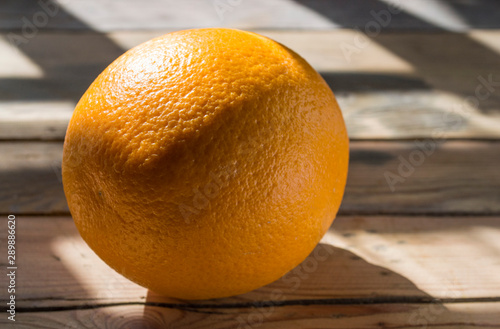 closseup orange on wooden background photo