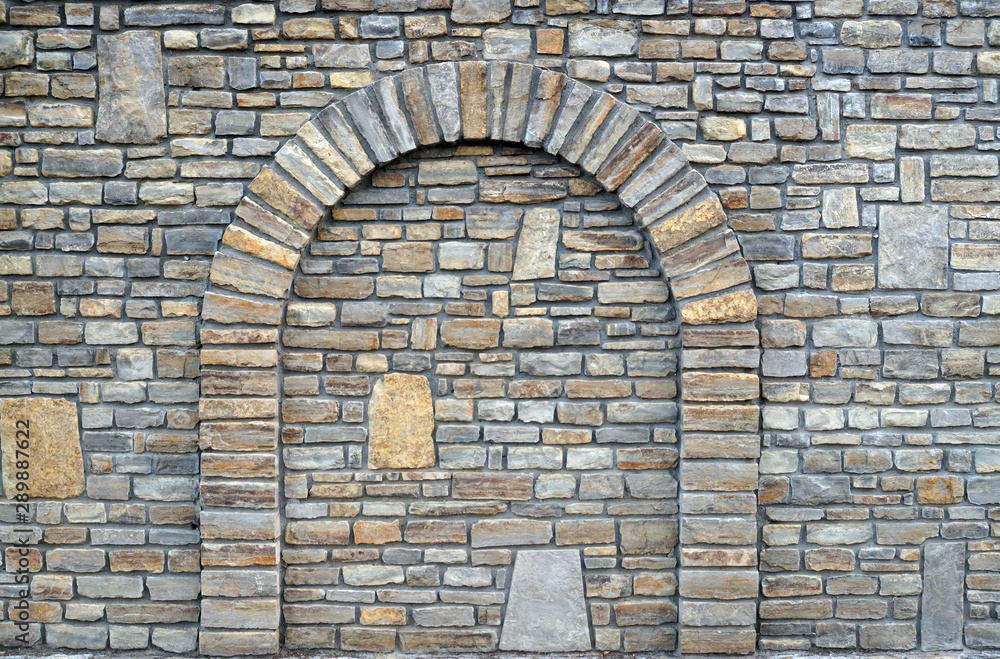 Walled-up archway in a stone wall