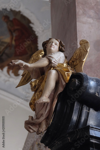 Angel, altar statue in the church of St. Agatha in Schmerlenbach, Germany photo