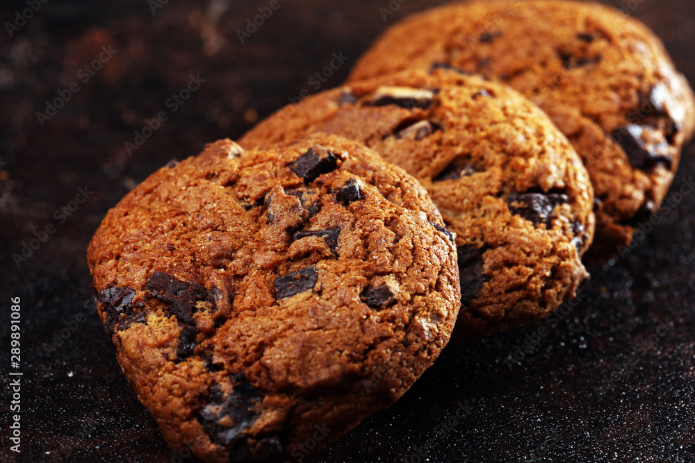 Chocolate cookies on wooden table. Chocolate chip cookies shot on table Chocolate cookies on wooden table. Chocolate chip cookies shot on table