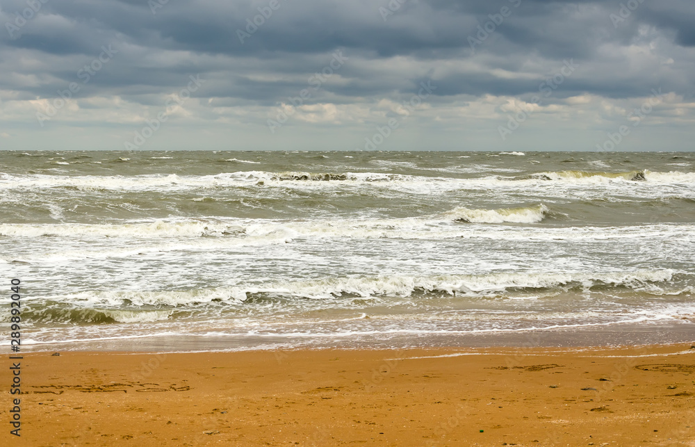 desert beach, clouds and sea