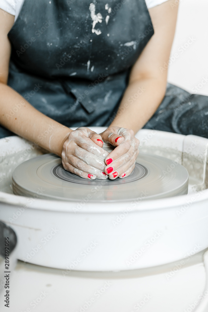 girl makes a product on a pottery wheel girl makes a product on a pottery wheel