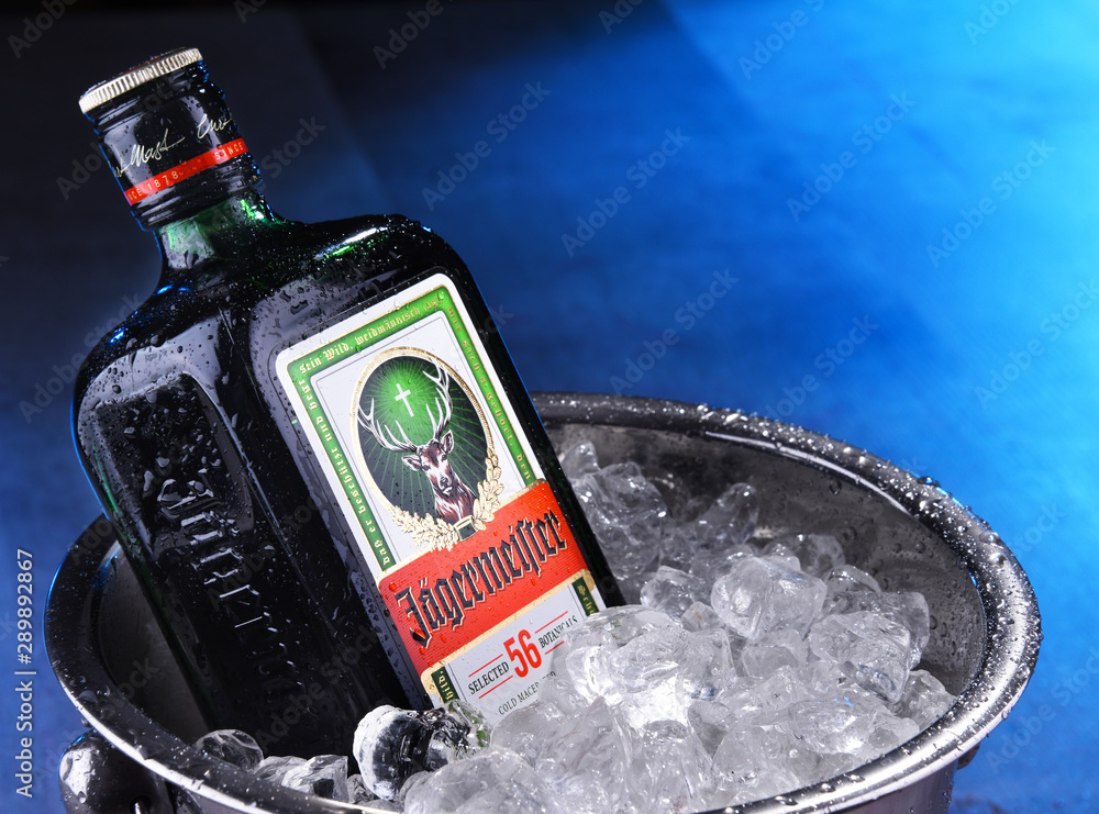 Bottle of Jagermeister herbal liqueur in bucket with crushed ice Stock  Photo | Adobe Stock