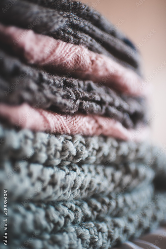 Stack of knitte clothes closeup. Winter season. Selective focus. Stack of knitte clothes closeup. Winter season. Selective focus.