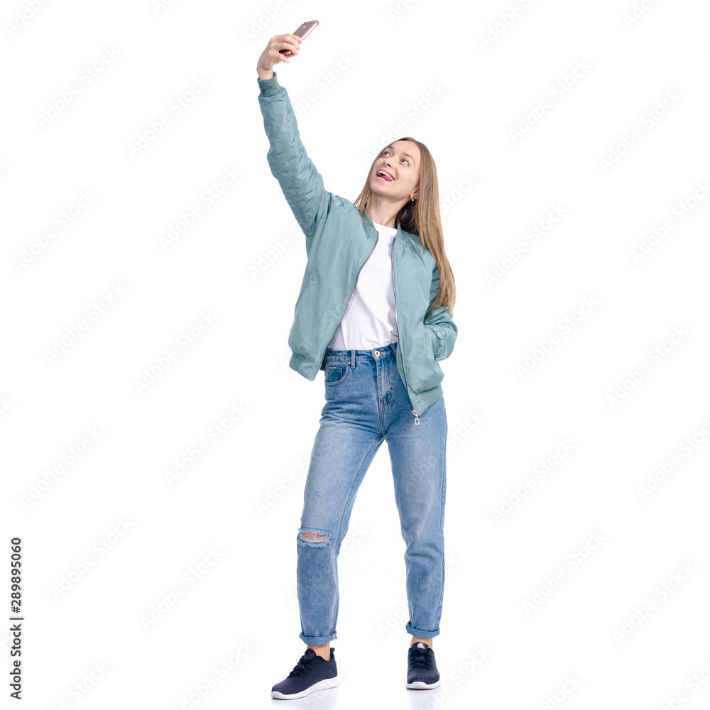 Woman in jeans coat jacket casual clothing standing smiling happiness making selfie on white background isolation Woman in jeans coat jacket casual clothing standing smiling happiness making selfie on white background isolation