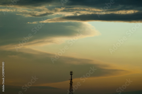 cell tower on sunset background