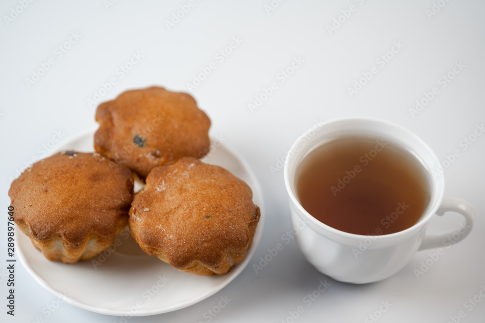 Cupcakes with tea on a white background Cupcakes with tea on a white background