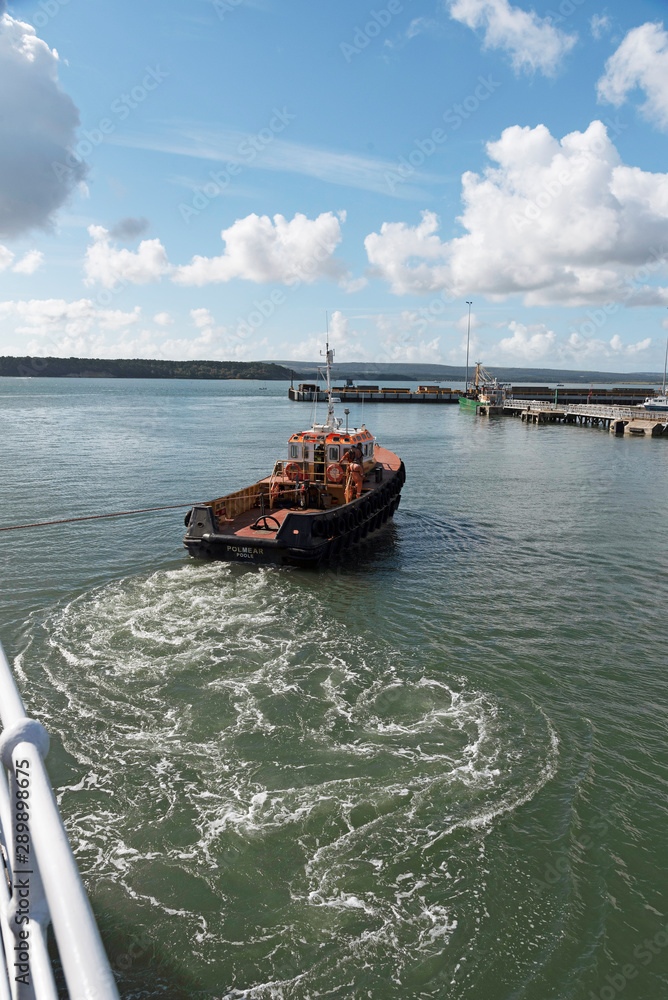Port of Poole, southern England, UK. September 2019. The Tug Polmear underway and working in Poole Harbour Port of Poole, southern England, UK. September 2019. The Tug Polmear underway and working in Poole Harbour