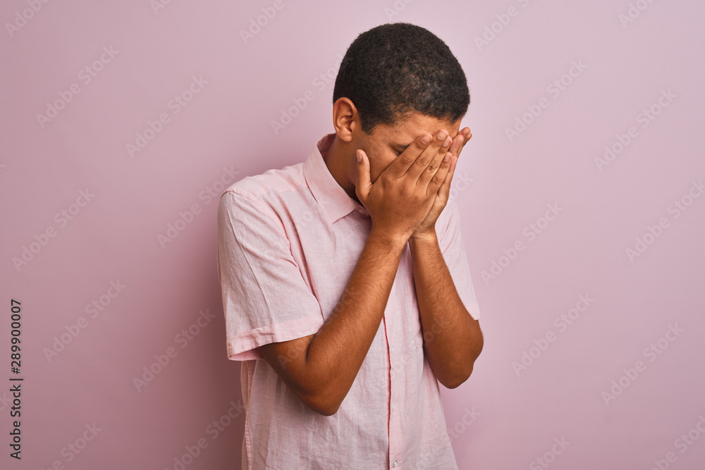 Young handsome arab man wearing casual shirt standing over isolated pink background with sad expression covering face with hands while crying. Depression concept. Young handsome arab man wearing casual shirt standing over isolated pink background with sad expression covering face with hands while crying. Depression concept.
