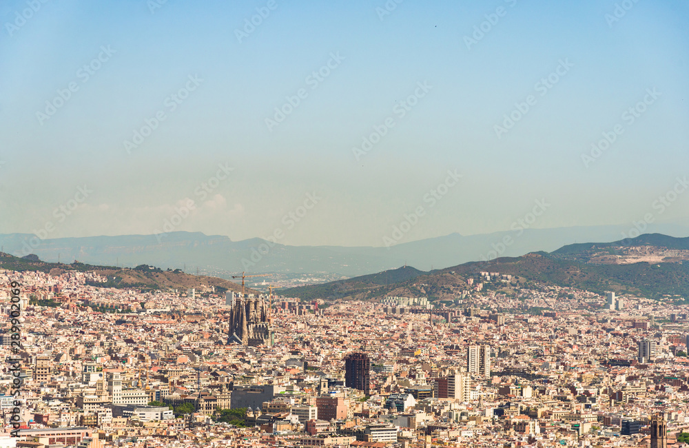 Panoramic view at Barcelona city, Sagrada Familia church, and mountains in Spain