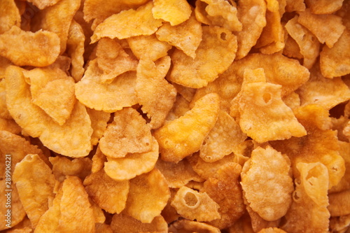 cornflakes in bowl on white background
