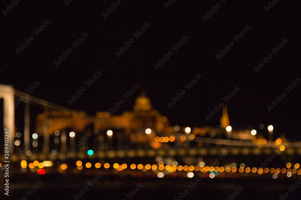 Obraz premium blurry lights of a big city at night. Background for travel photos. bokeh advertising poster