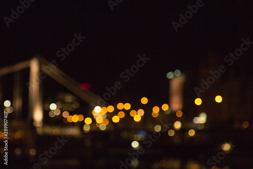 blurry lights of a big city at night. Background for travel photos. bokeh advertising poster © Yuliia