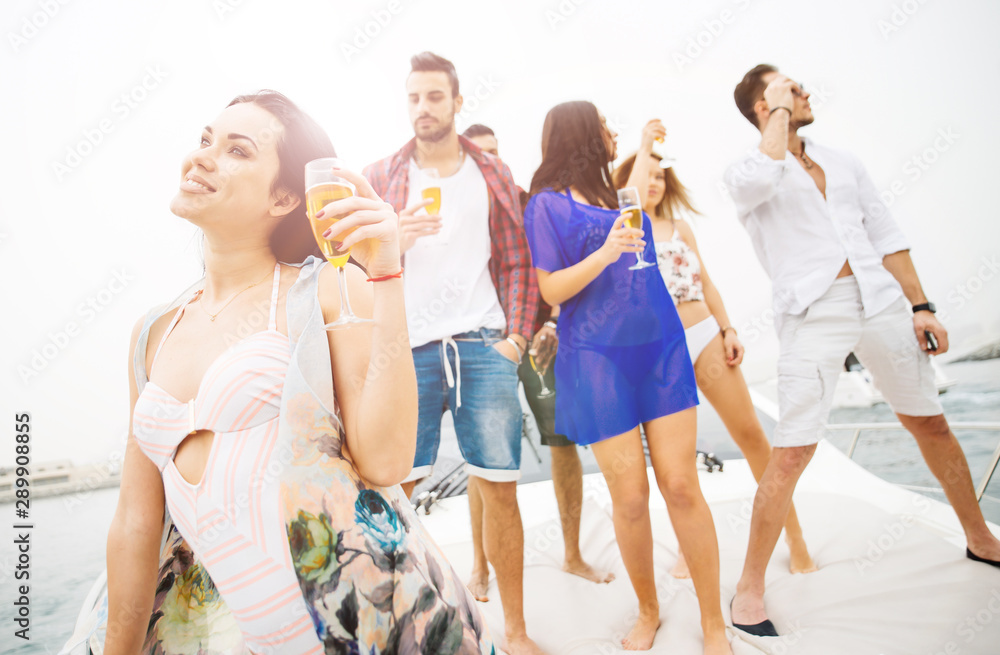 Naklejka premium Group of friends making party on a yacht in Dubai