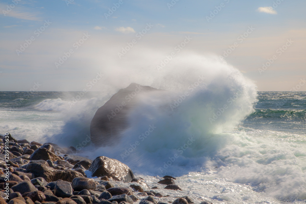 Large waves hit a rocky coastline in Norway