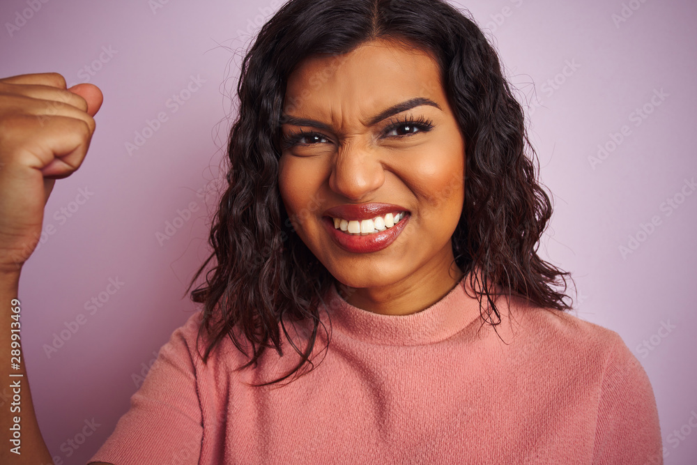 Young beautiful transsexual transgender woman standing over isolated pink background annoyed and frustrated shouting with anger, crazy and yelling with raised hand, anger concept Young beautiful transsexual transgender woman standing over isolated pink background annoyed and frustrated shouting with anger, crazy and yelling with raised hand, anger concept