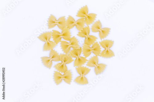 Farfalle pasta isolated on white background. Pasta in the form of bows.