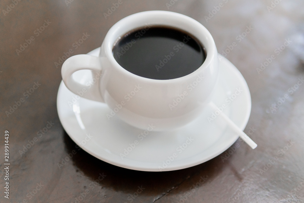 Tada with coffee, white color in small plate on the table. Tada with coffee, white color in small plate on the table.