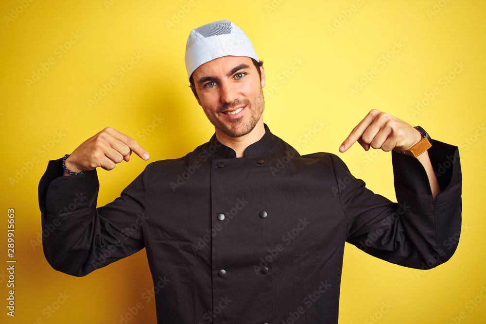 Young handsome chef man cooking wearing uniform and hat over isolated yellow background looking confident with smile on face, pointing oneself with fingers proud and happy. Young handsome chef man cooking wearing uniform and hat over isolated yellow background looking confident with smile on face, pointing oneself with fingers proud and happy.