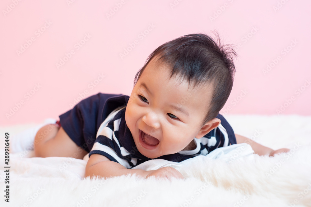 Happy newborn cute baby in studio Happy newborn cute baby in studio