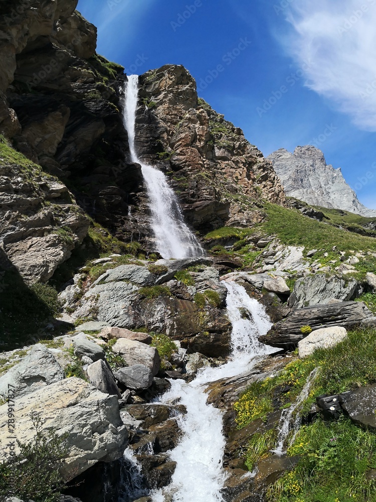Waterfall in the mountains- Cervino Waterfall - Breuil-Cervinia, Italy