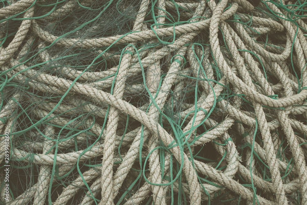 Ropes tangled in green fishing nets