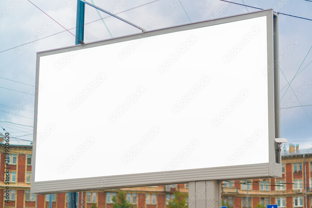 Big billboard in the city during the day against the background of the city. mockup advertising. Big billboard in the city during the day against the background of the city. mockup advertising.