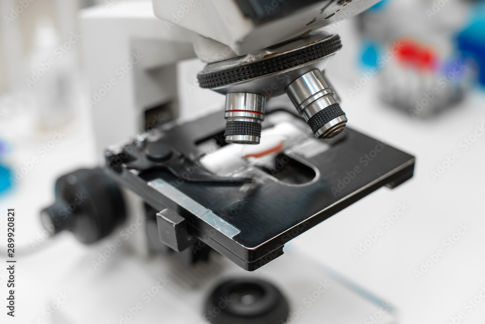 Closeup blood sample on glass in microscope. Closeup blood sample on glass in microscope.