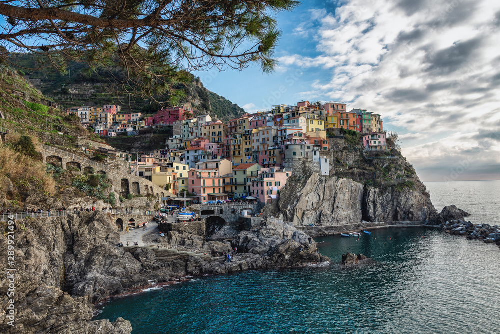 The best panorama of Italy. Manarolla. Ligurian coast. Cinque Terre National Park. Stone path to the sea. Medieval town on a rock by the sea.