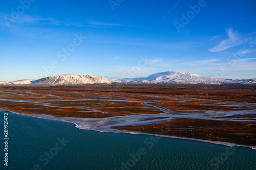 Volcano Hekla in Iceland covered by snow cap and winter landscape