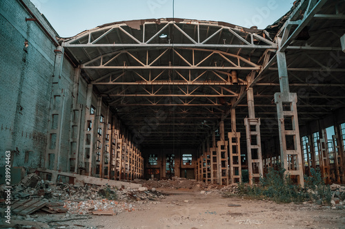 Ruined industrial hall of warehouse or hangar in process of reconstruction