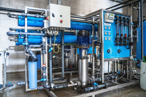 System of automatic treatment and multi-level filtration of drinking water produced from well. Plant or factory for production of purified drinking water photo