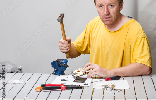 Man repairing cell phone photo